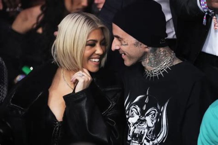 Kourtney Kardashian & Travis Barker Kick Each Other’s Butts Backstage at Blink-182 Show: Watch