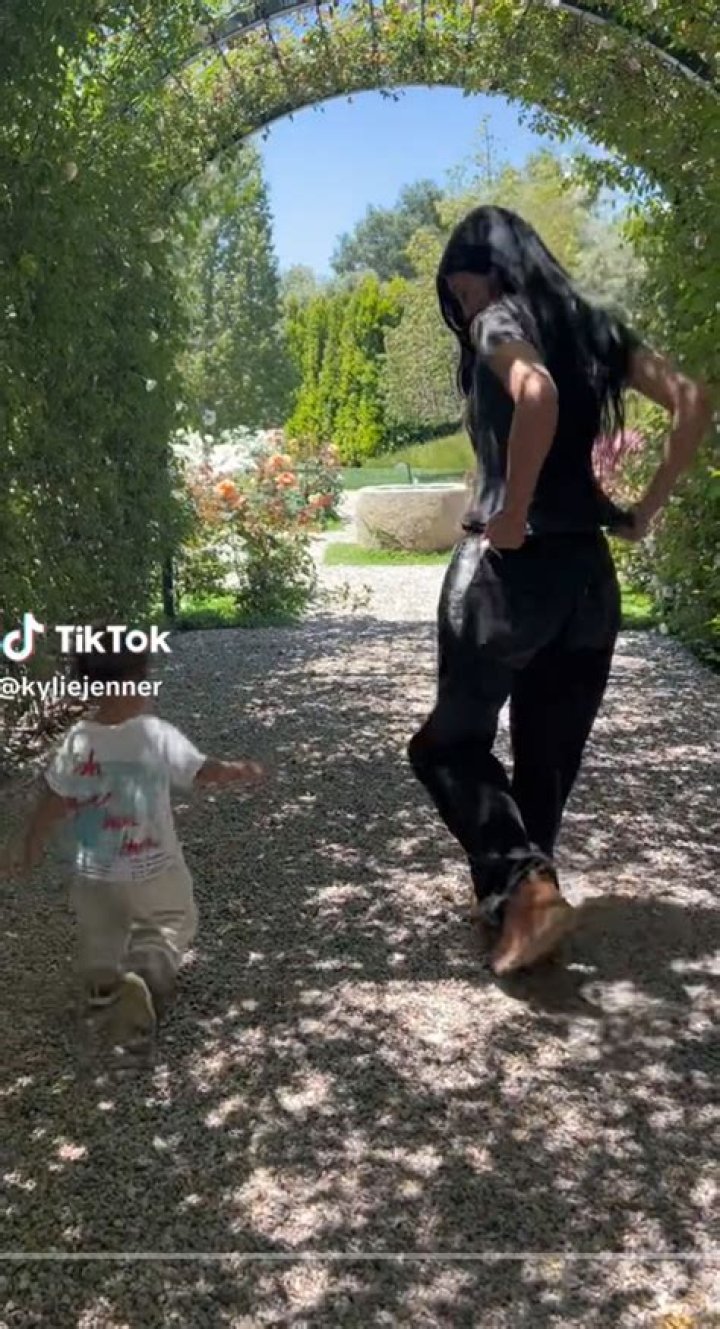 Kylie Jenner Wears Green Bikini Top & Skirt While Playing With Stormi, 4, On Vacation