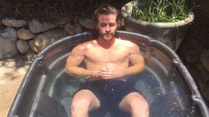 Liam Hemsworth Puts Abs & Bulge On Display In Teeny Tiny Speedo & We’re Drooling