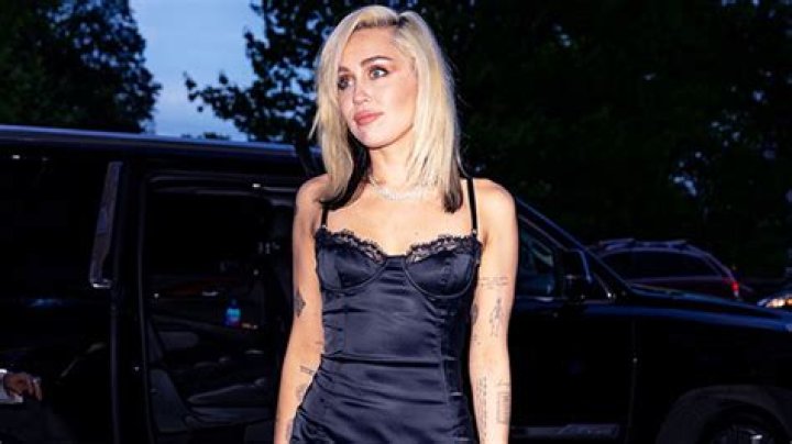 Miley Cyrus’ Black Satin Mini Dress & Long Hair In NYC – Photos – Hollywood Life