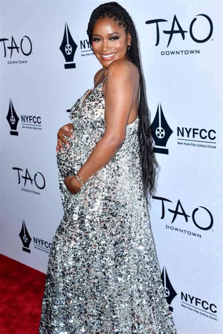 She Cradles Her Baby Bump – Hollywood Life